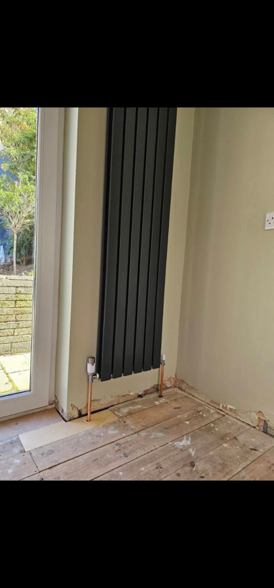 Designer vertical radiator installed